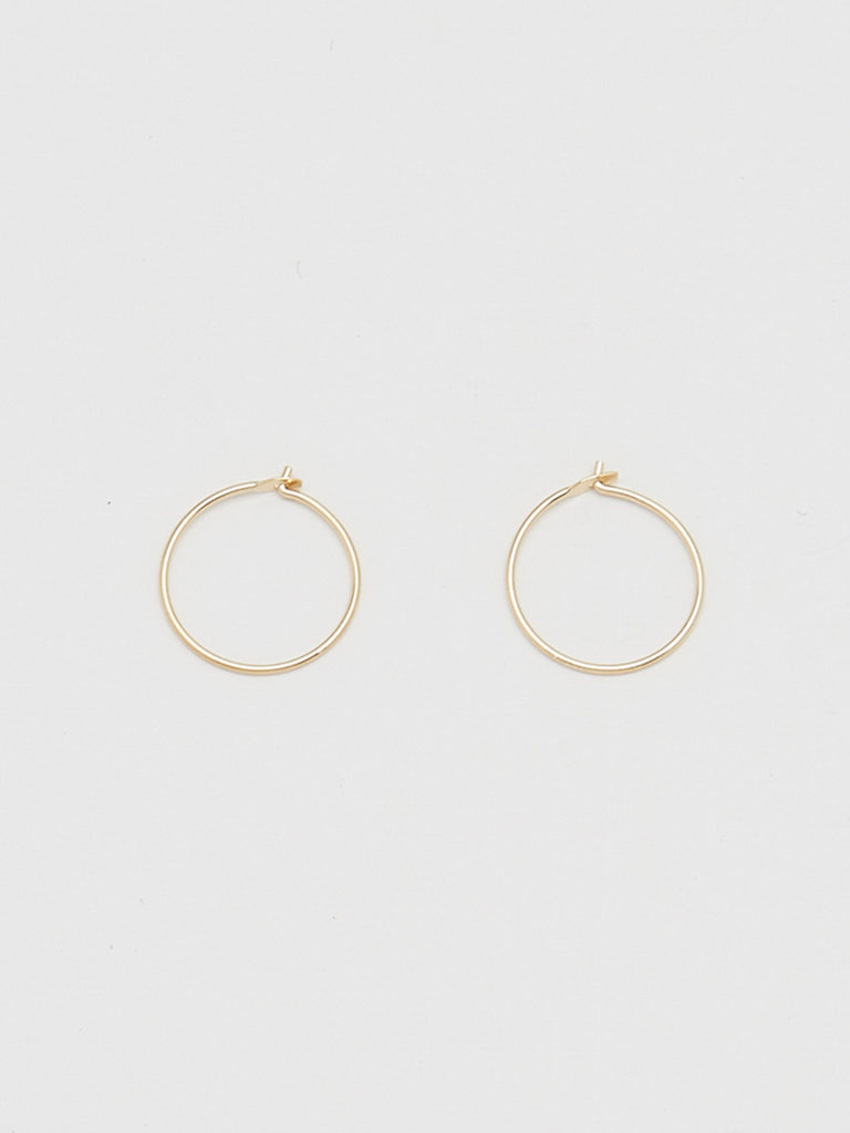 Close up flat lay of 14K 302 Mini Hoops Earrings Bagatiba