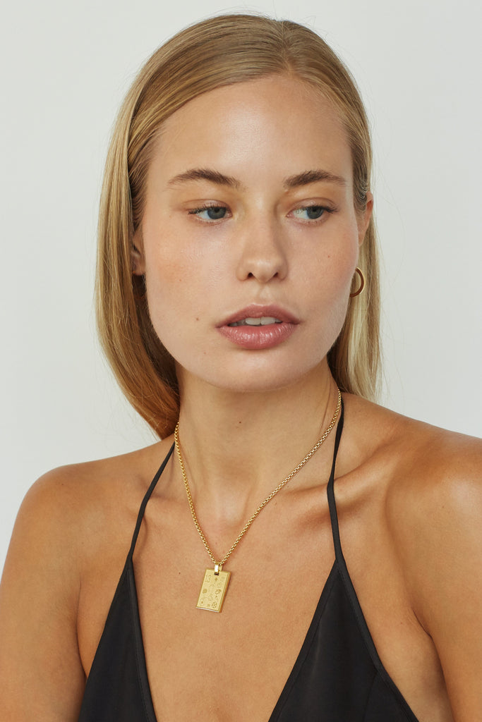 Model wearing 16" Snake Chain Necklace with Lucky Charm bagatiba