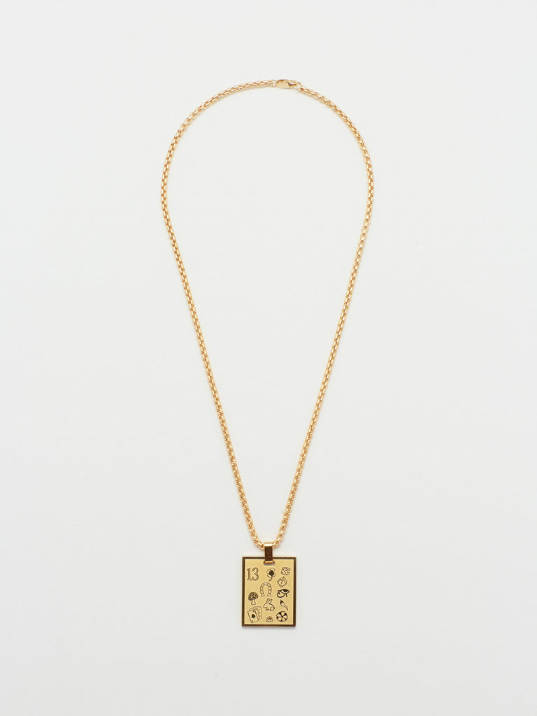 Full view flat lay of 16" Snake Chain Necklace with Lucky Charm bagatiba