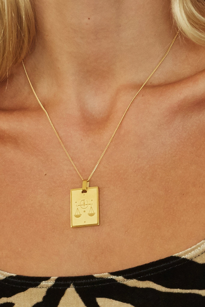 Cropped view on model of 18" Spiral Necklace with Libra charm added  bagatiba