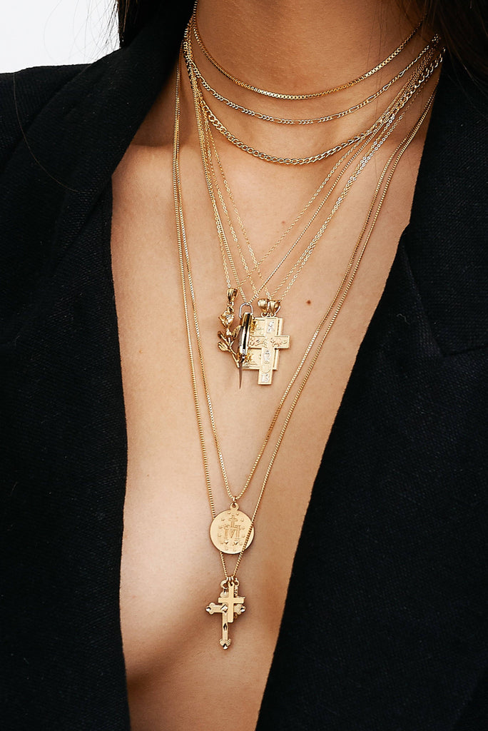 Cropped view on model of 22" Pray For Mary Square Necklace with many other Necklace styles bagatiba