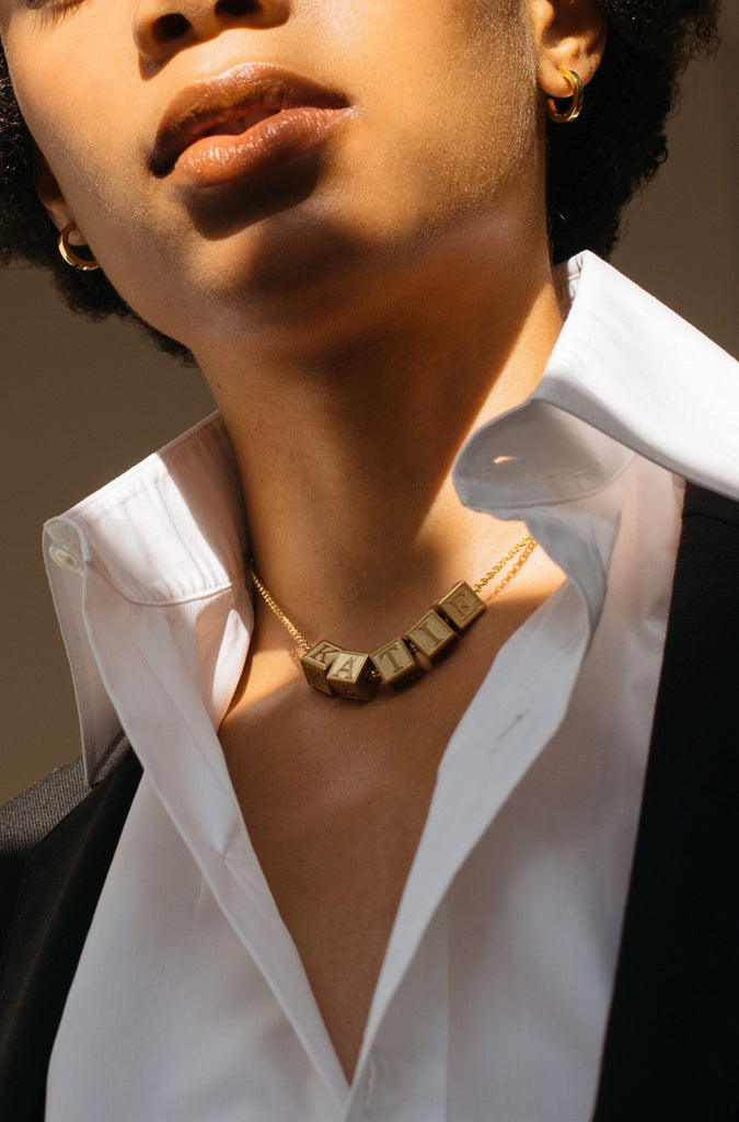 Model wearing 5 Letter Block letters on chain  Bagatiba