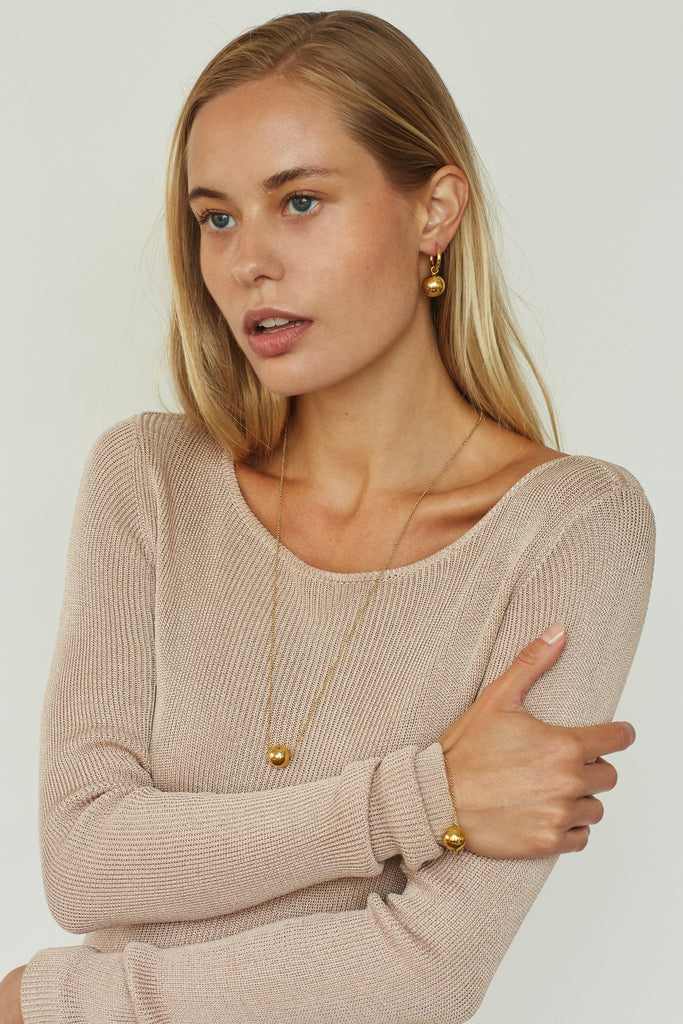 Model profile view wearing Adjustable Sphere Bracelet bagatiba