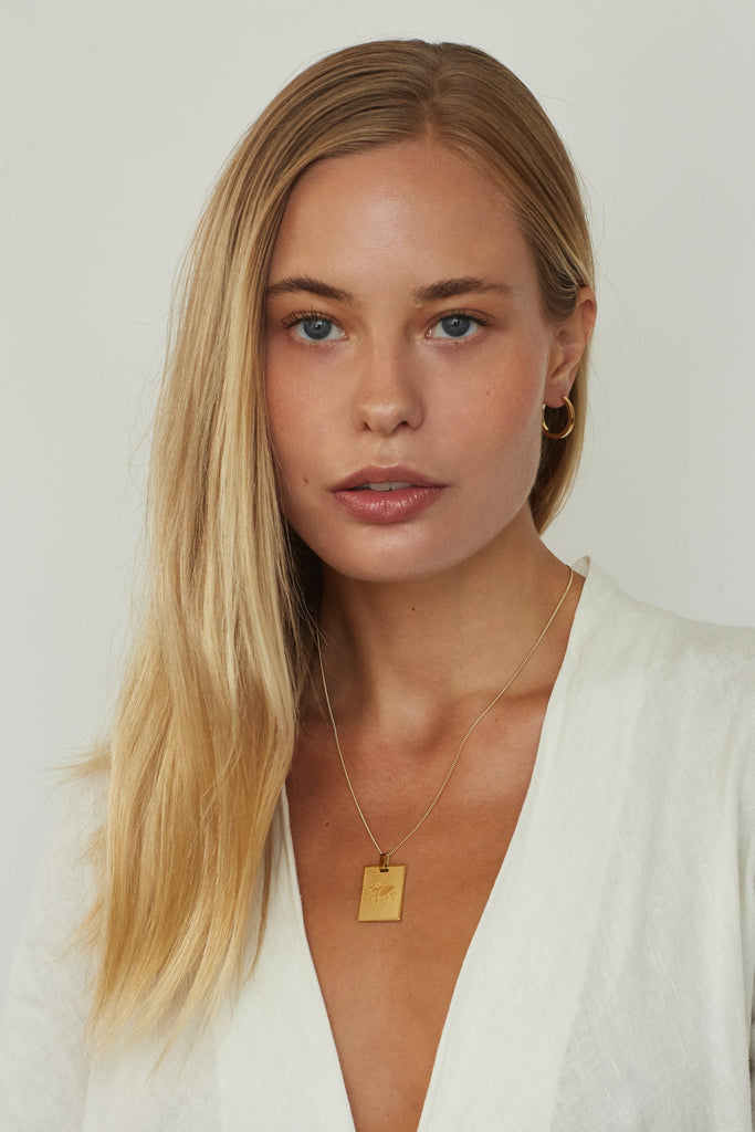 Model wearing Aries Charm charm Bagatiba