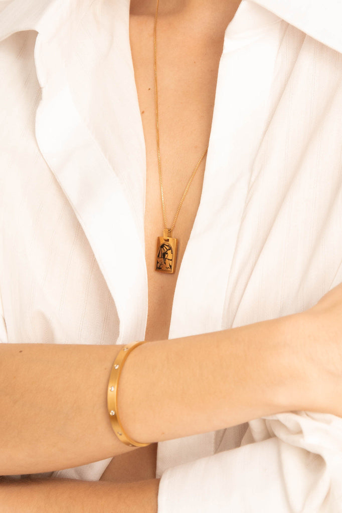 Detail of model wearing Bagatiba Long Cage Necklace and Gemma bracelet  Bagatiba