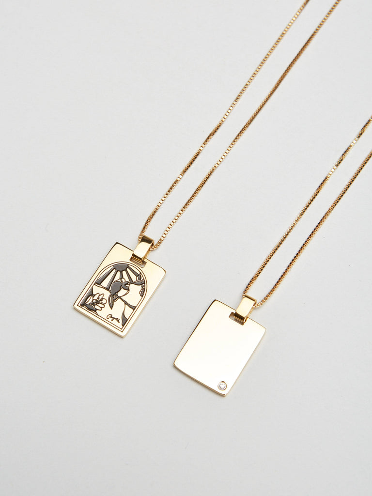 Flat lay view of both sides of Bagatiba Long Cage Necklace Necklace Bagatiba