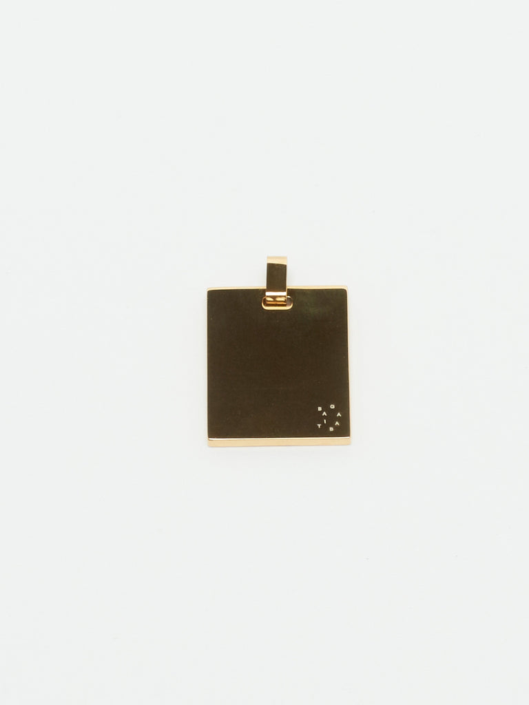 Detail view flat lay of reverse side Bagatiba Lucky Charm Necklace charm Bagatiba
