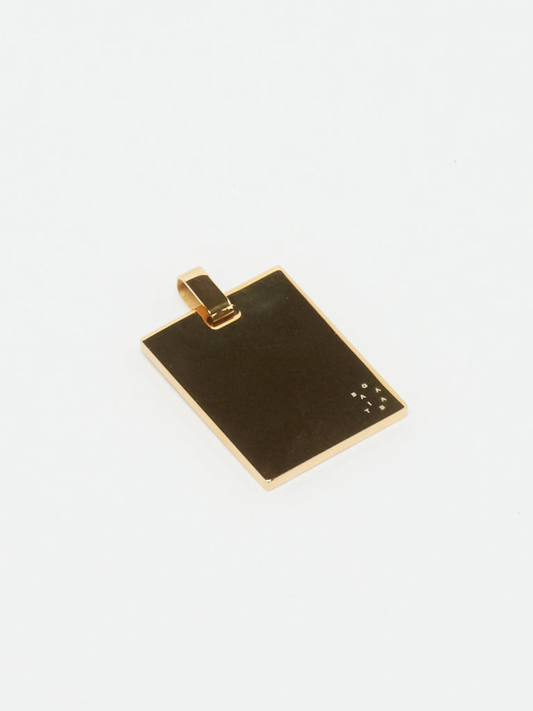 Flat lay view of reverse side of Bagatiba Lucky Charm Necklace charm Bagatiba