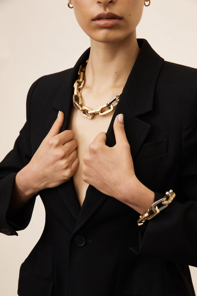 Model torso view wearing Brushed Gold Cara Clips in Necklace & bracelet Bagatiba