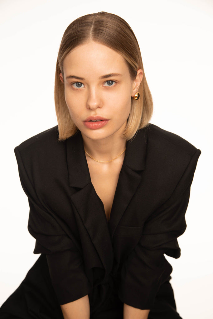 Model wearing Button Studs Earrings paired with a choker chain  Bagatiba
