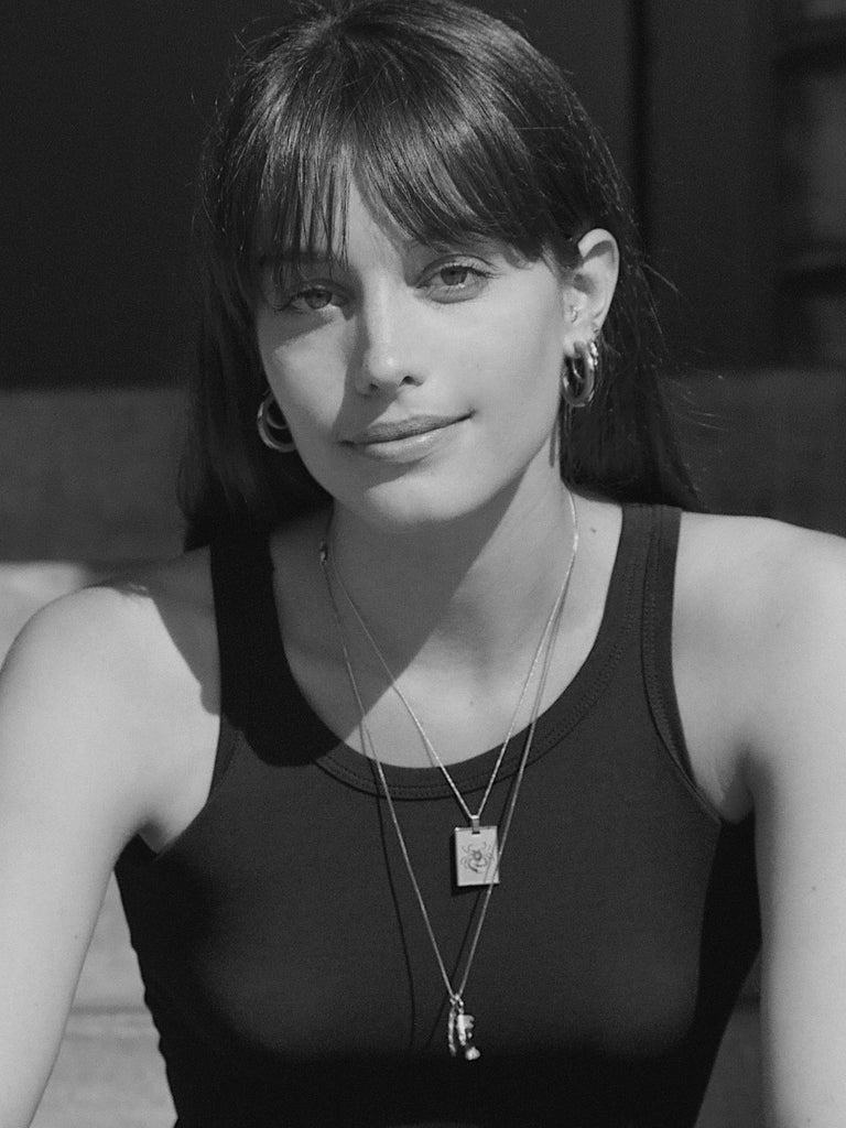 Black and White photo of Model wearing Cancer Charm charm Bagatiba