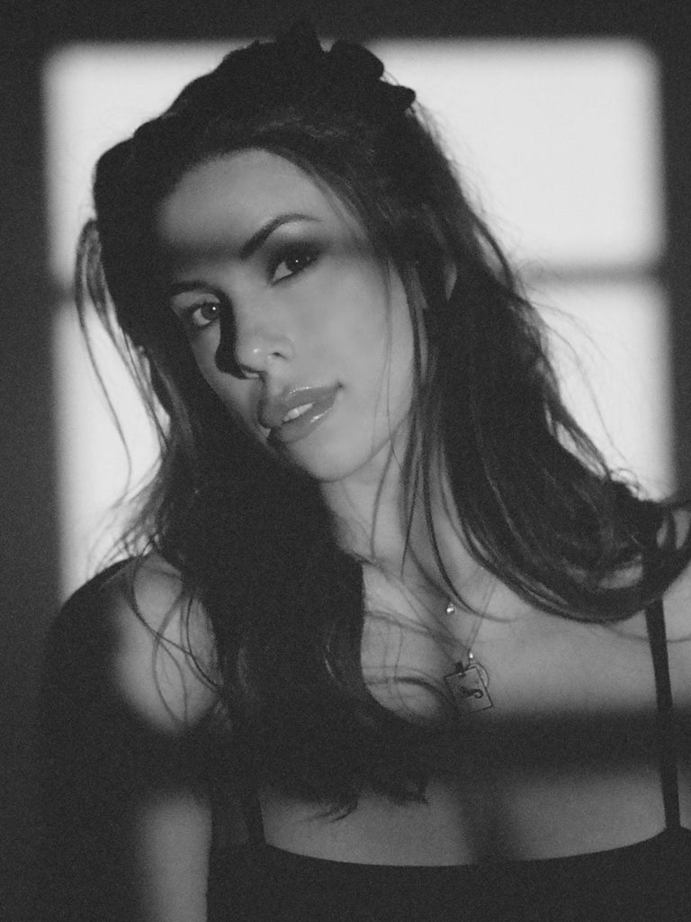 Black and White photo of model in Capricorn Charm charm Bagatiba