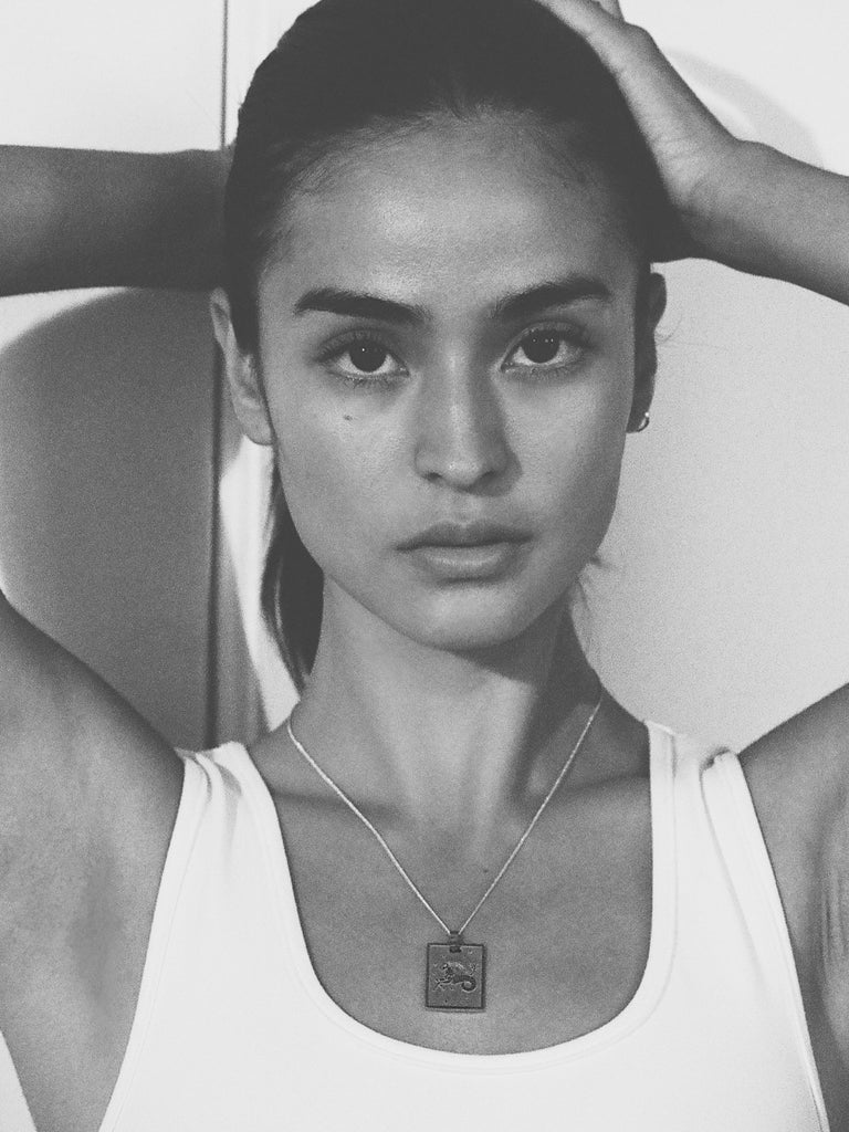 Black and White photo of model in Capricorn Charm charm Bagatiba