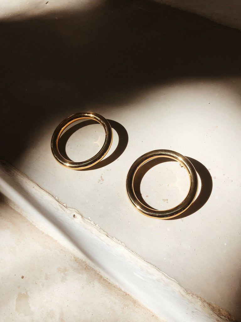 flat lay in natural light of Circle Hollow Hoops Earrings bagatiba