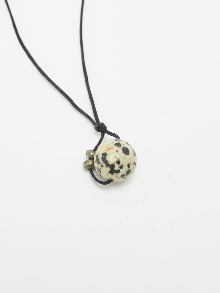 Dalmatian Drop Necklace necklace flat lay close up