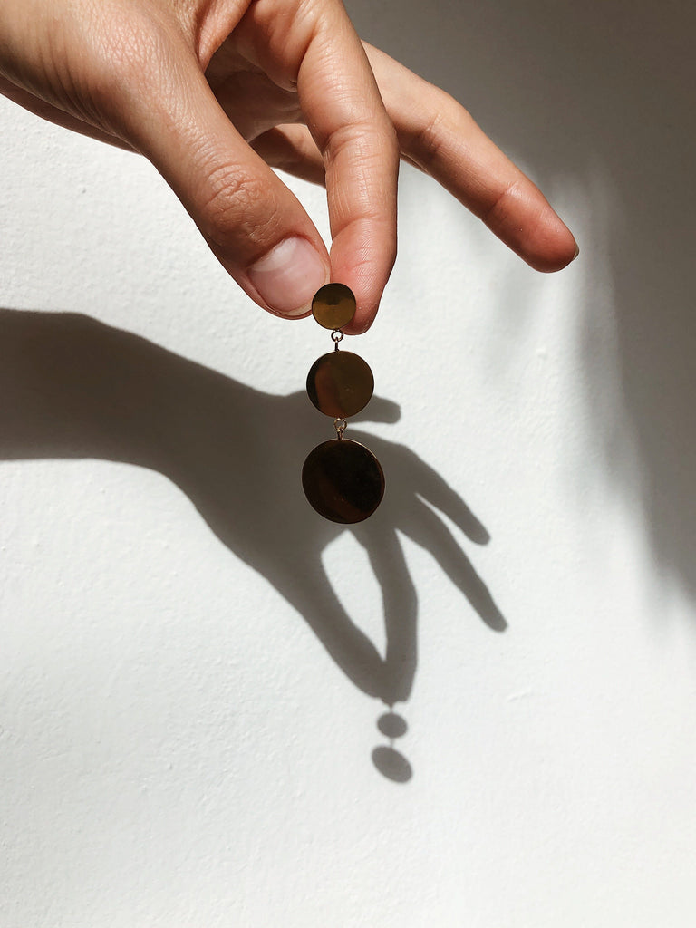 Dangle dot earring in natural light