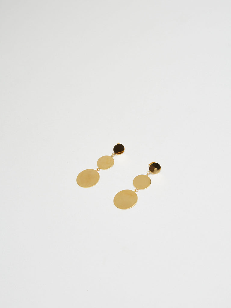 Full view flat lay of Dangle Dot Earrings laying at an angle Bagatiba