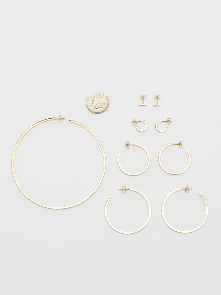 Full view flat lay of Diamond Earrings collection including Bar Studs Earrings Bagatiba