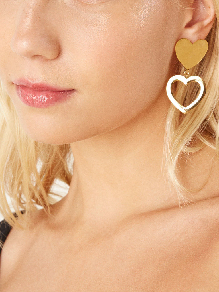 Cropped view on model wearing Double Heart Stud Earrings Earrings bagatiba