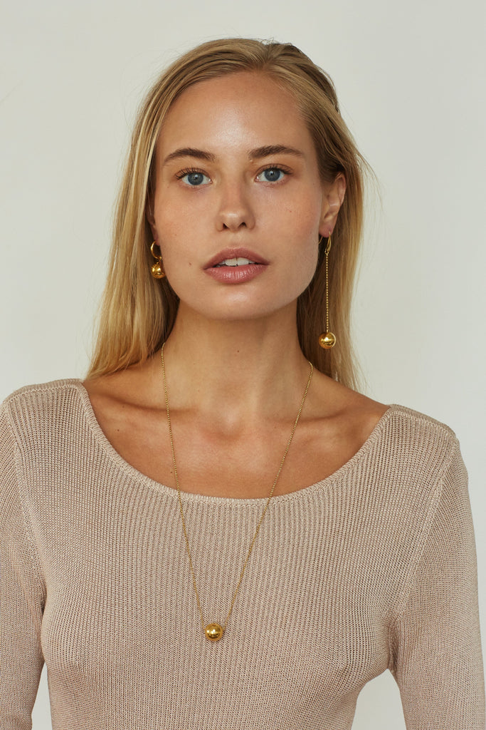 Model wearing Drop Sphere Earring & Sphere Hoop  Earrings bagatiba