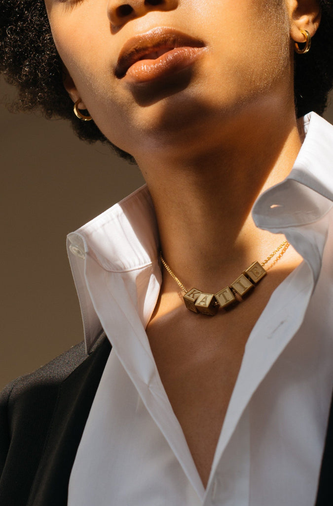 Model wearing 5 Letter Block letters on choker chain Bagatiba