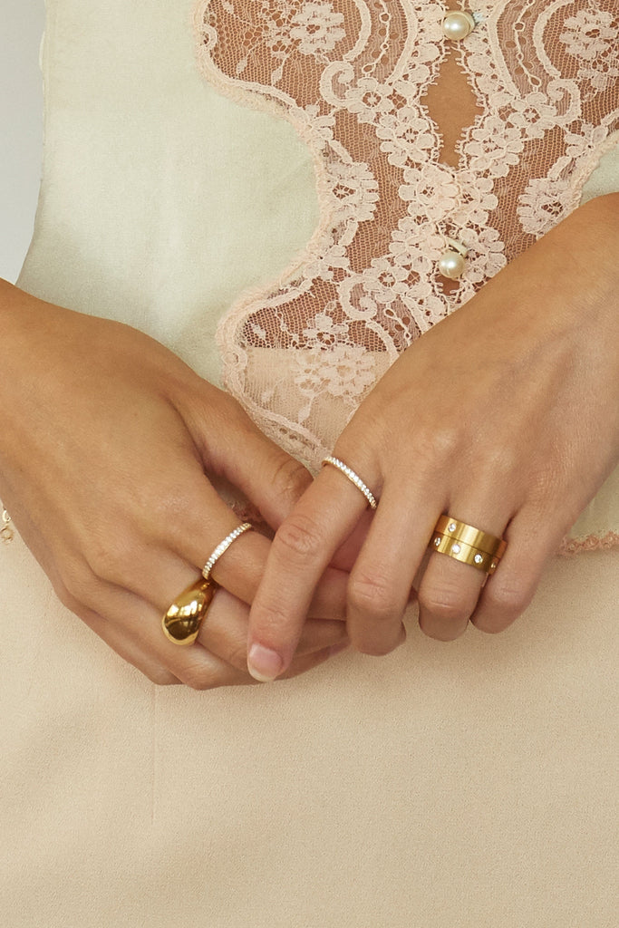 Close view of model wearing multiple rings including the Ella Diamond Ring Ring Bagatiba