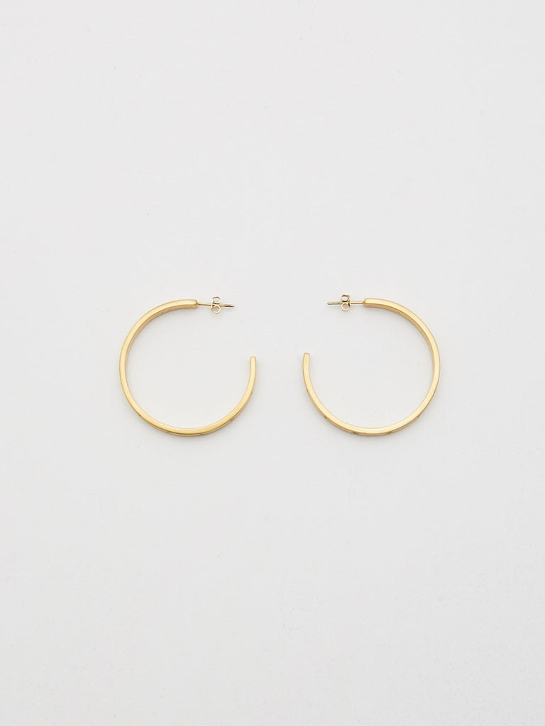 Top view flat lay of Gemma Diamond Hoops Earrings bagatiba