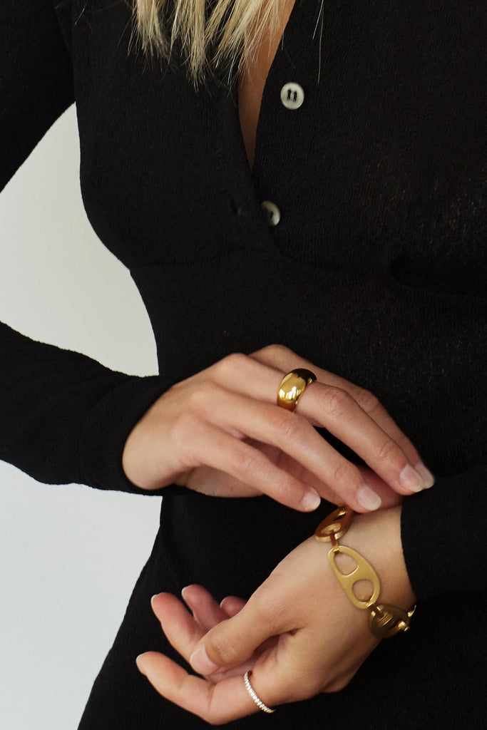 Cropped view on model wearing Gold Brushed Tab Bracelet Bracelet bagatiba