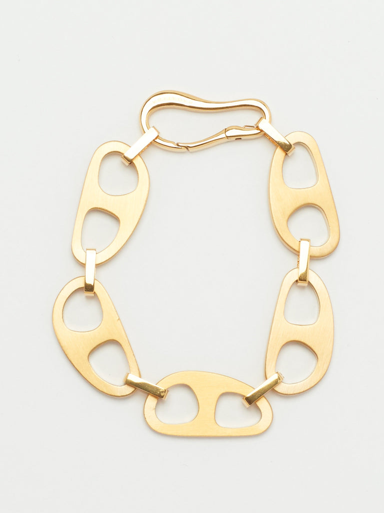 close up flat lay of Gold Brushed Tab Bracelet Bracelet bagatiba