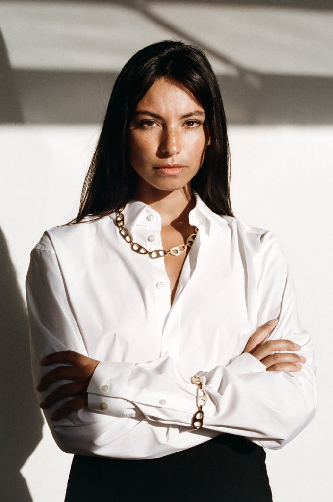 Model photographed in natural light wearing Gold Brushed Tab Bracelet Bracelet bagatiba