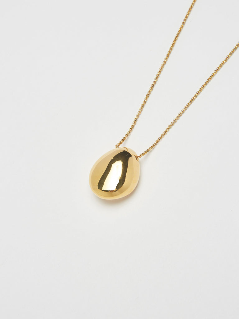 Close view flat lay of Gold Orb Necklace Necklace bagatiba