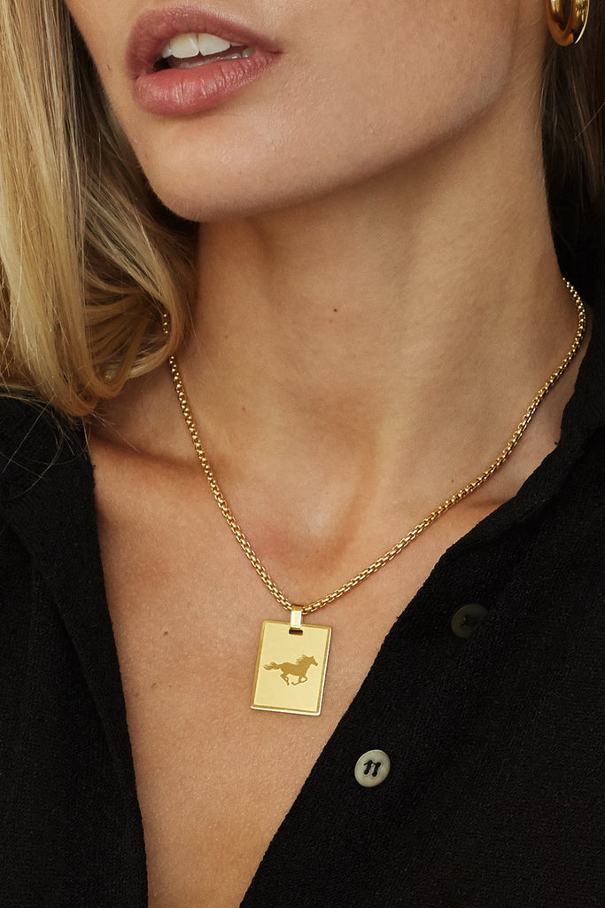 Cropped view model wearing Horse Charm charm Bagatiba