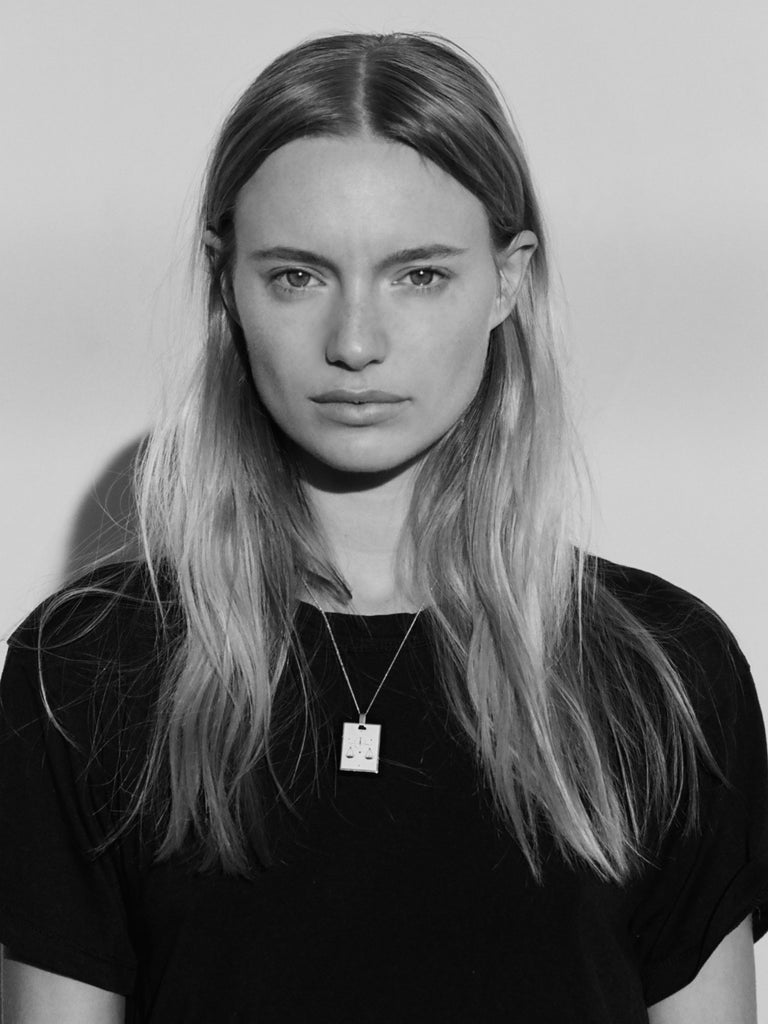 Black & White photo of model wearing Libra Charm charm Bagatiba