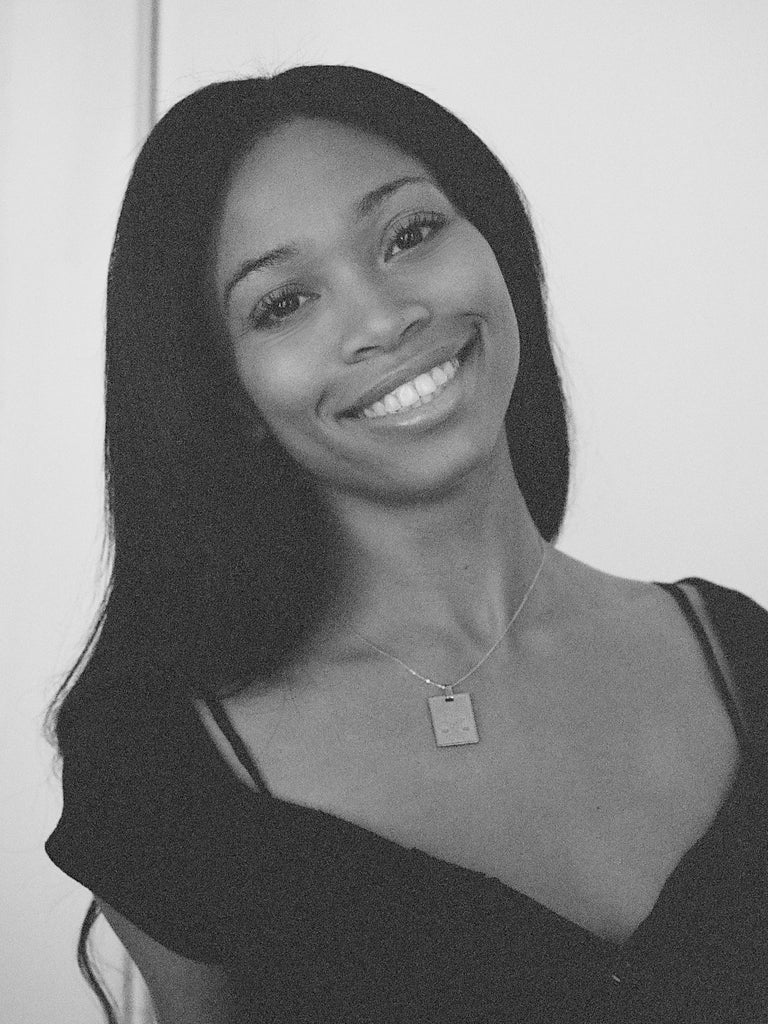 Black & White photo of model wearing Libra Charm charm Bagatiba