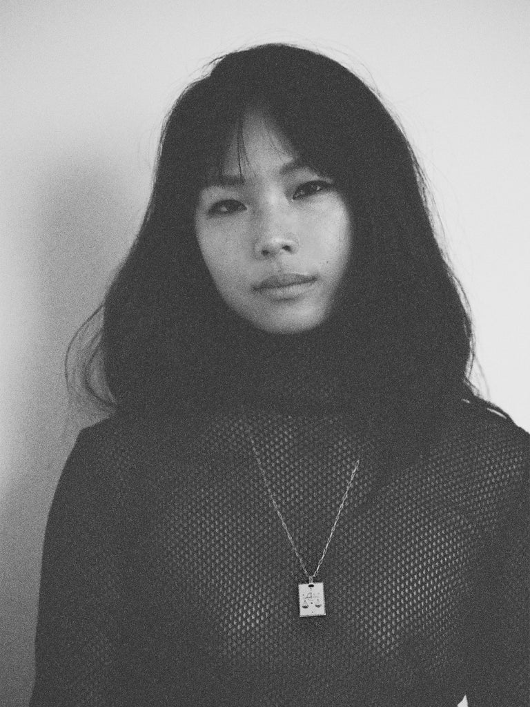 Black & White photo of model wearing Libra Charm charm Bagatiba