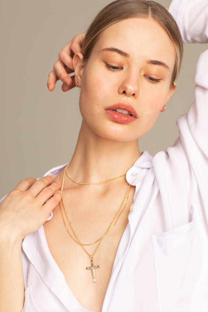 Model wearing the Long Roller Cross Necklace Necklace Bagatiba