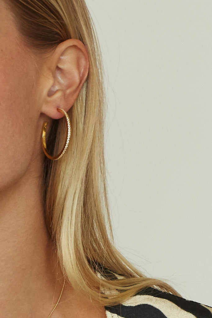 Detail view on model of Medium Diamond Hoops Earrings Bagatiba