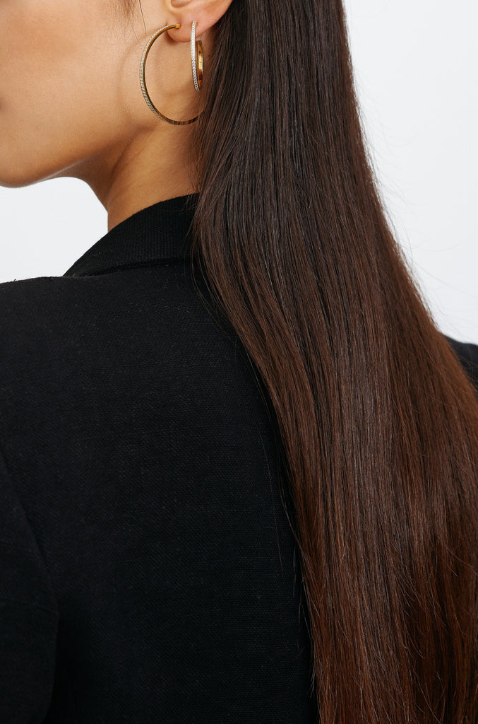 Model side profile view wearing Medium Diamond Hoops Earrings Bagatiba