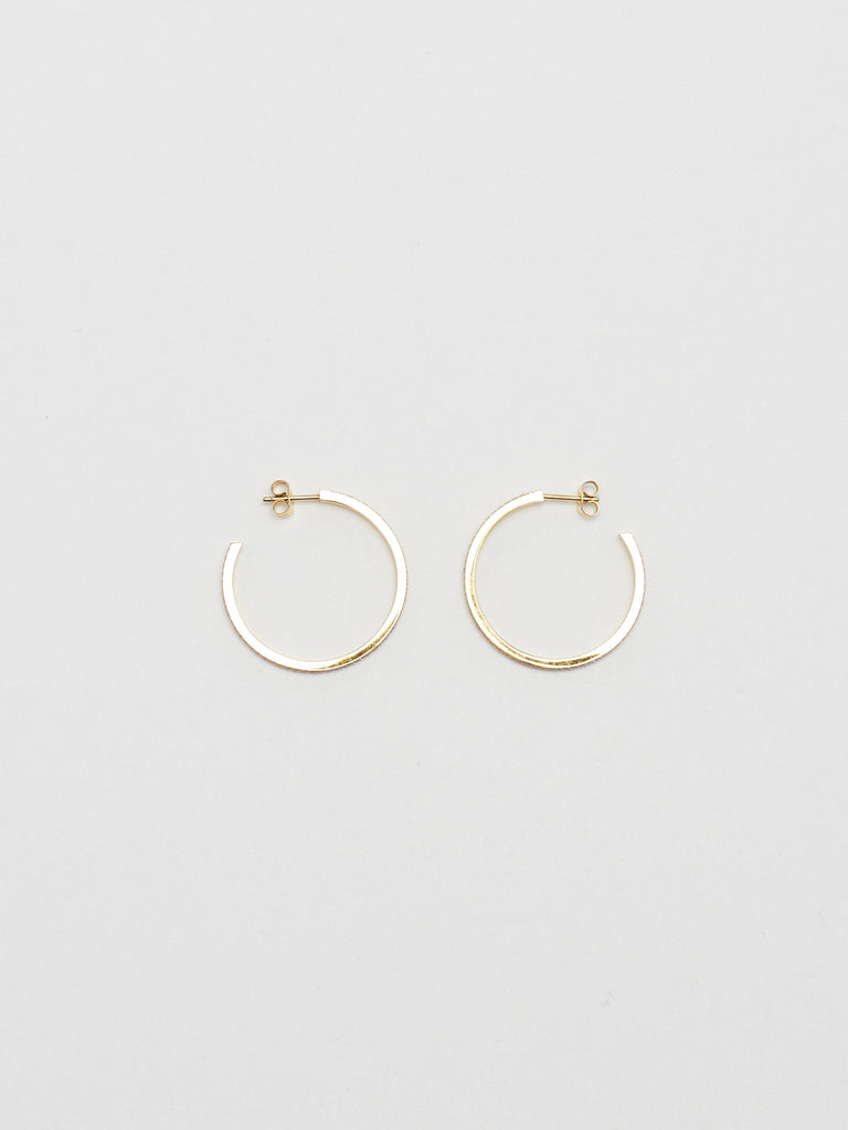 Flat lay of Medium Diamond Hoops Earrings Bagatiba