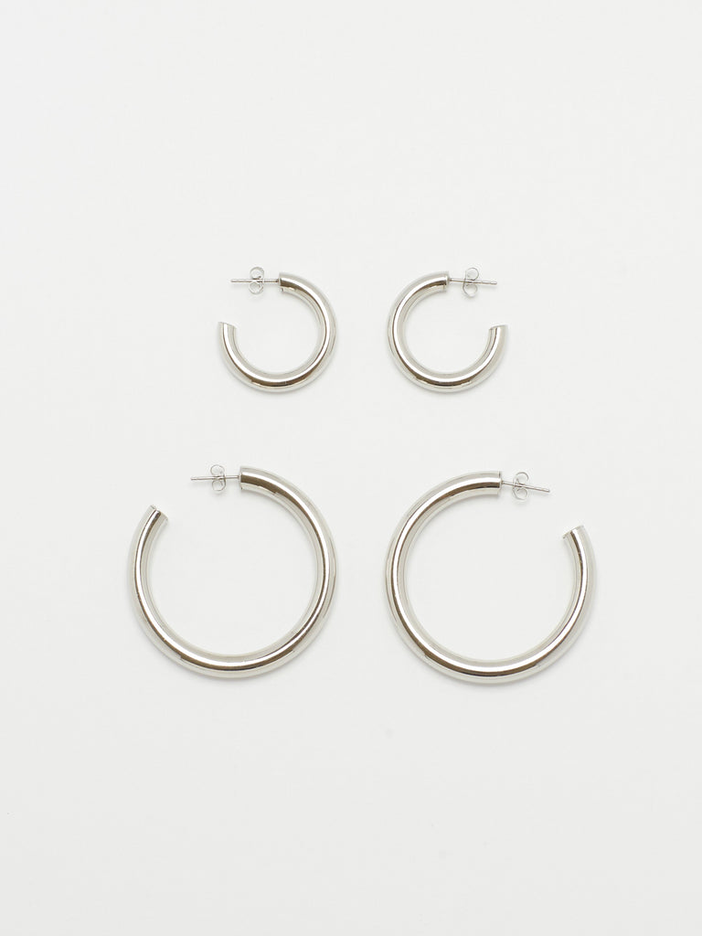 Flat lay of Mini Silver Hollow Hoops & Silver Hollow Hoops  Earrings Bagatiba