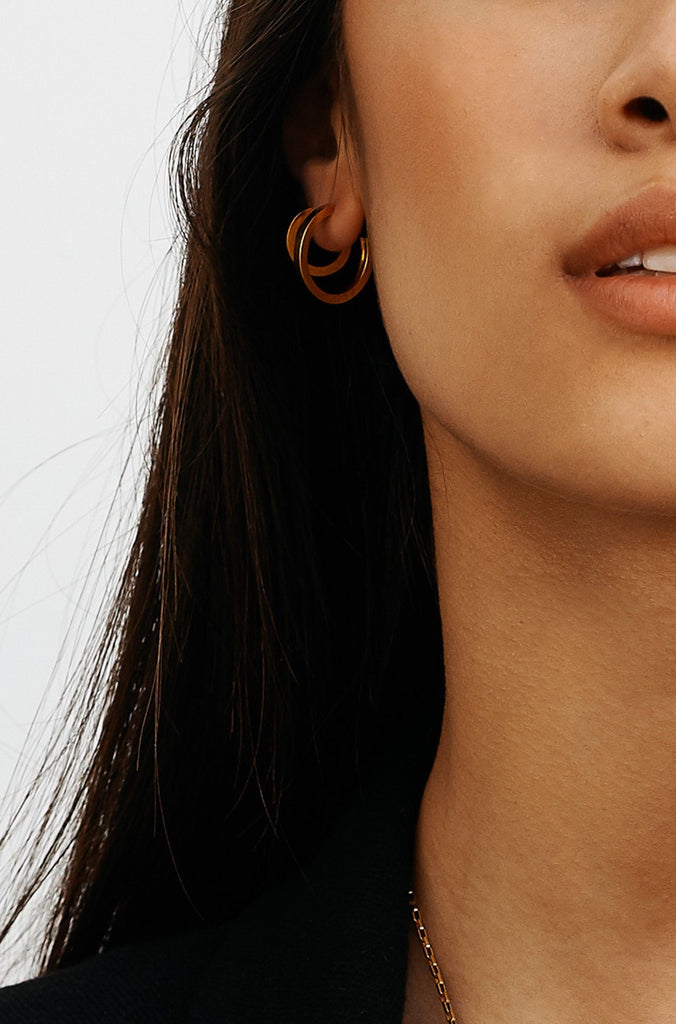 Cropped view of model wearing Mini Simple Gold Hoops Earrings Bagatiba