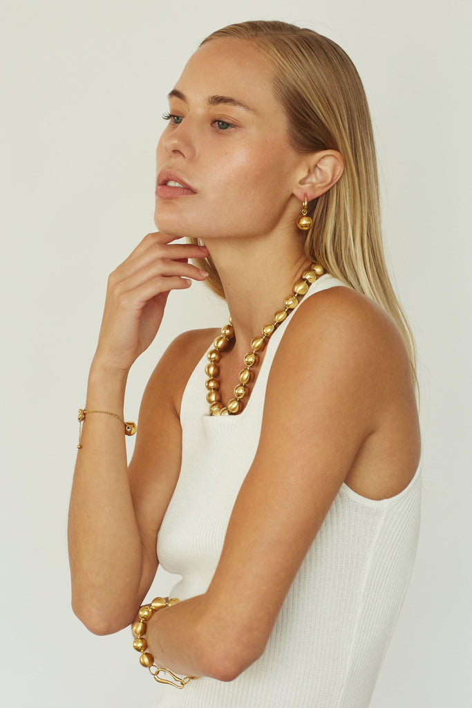 Profile view of model wearing Mixed Sphere Necklace Necklace bagatiba