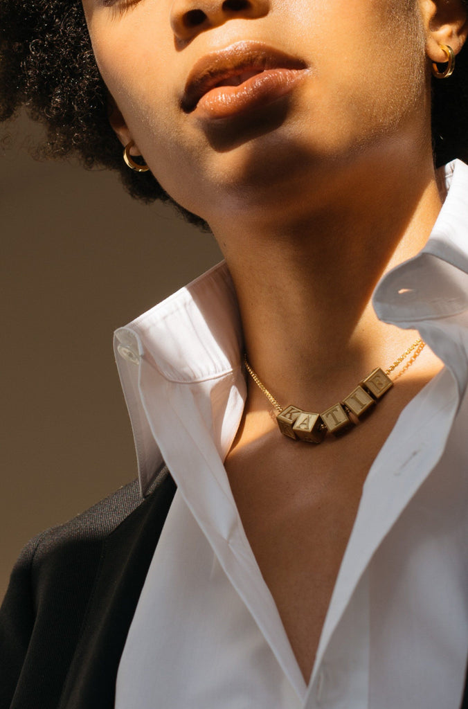 Model wearing 5 Letter Block letters on choker chain  Bagatiba