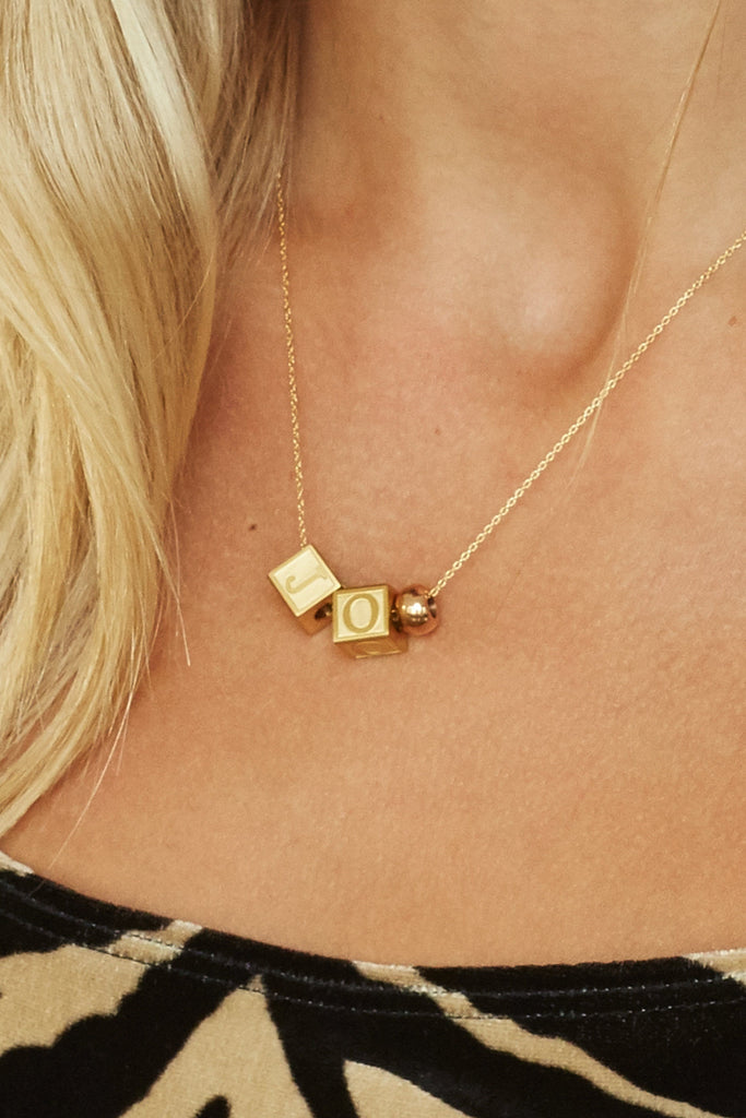 close up of model  wearing "J" "O" Letter Block letters Bagatiba