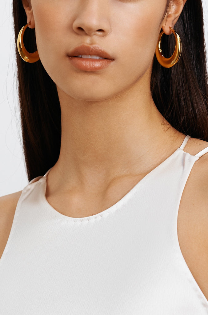 Model wearing the Orb Hoops Earrings bagatiba