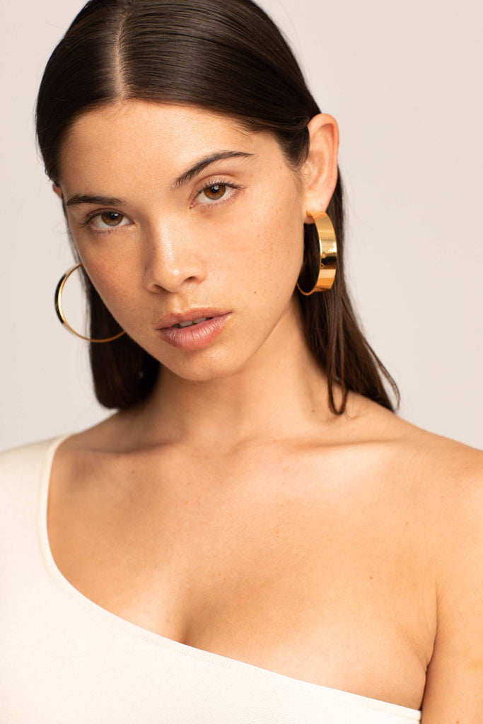 Profile view on model of Oversized Roma Hoops Earrings Bagatiba