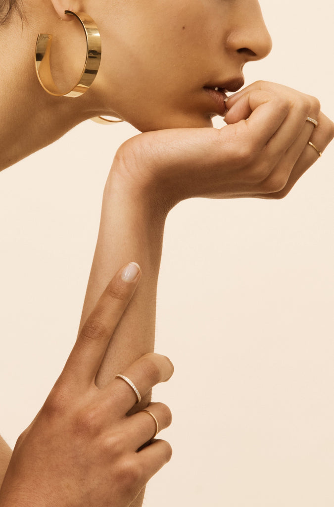 side profile view of the Oversized Roma Hoops Earrings by Bagatiba on model