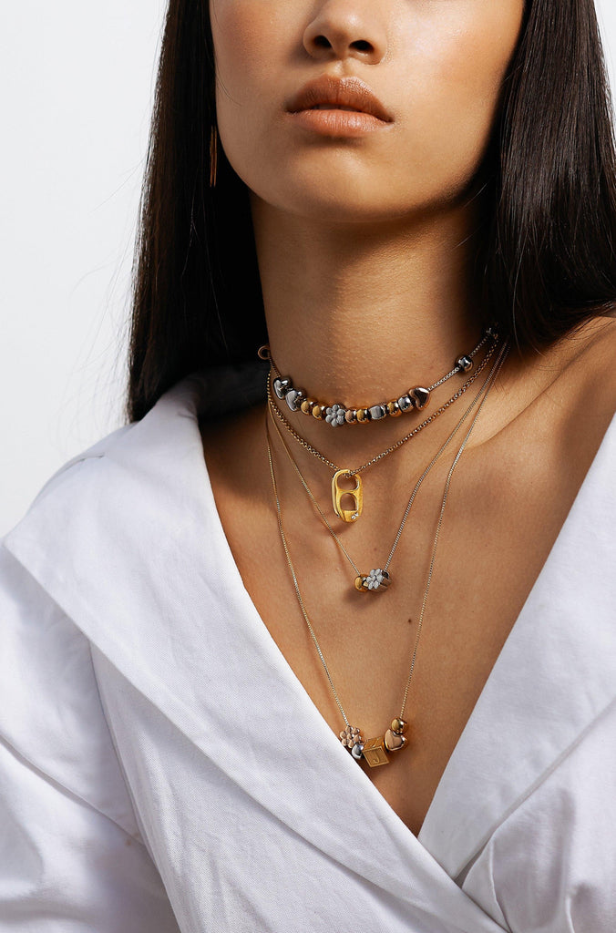 Full view of model wearing 4 build it necklaces  Bagatiba