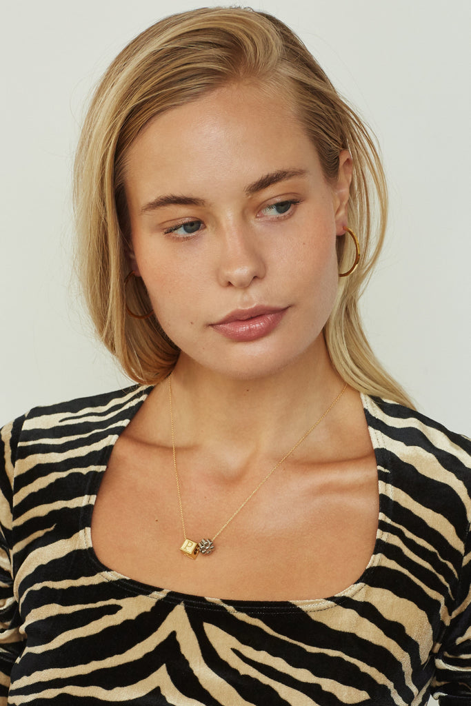 Model wearing "P" Letter Block letters on chain with flower bead  Bagatiba