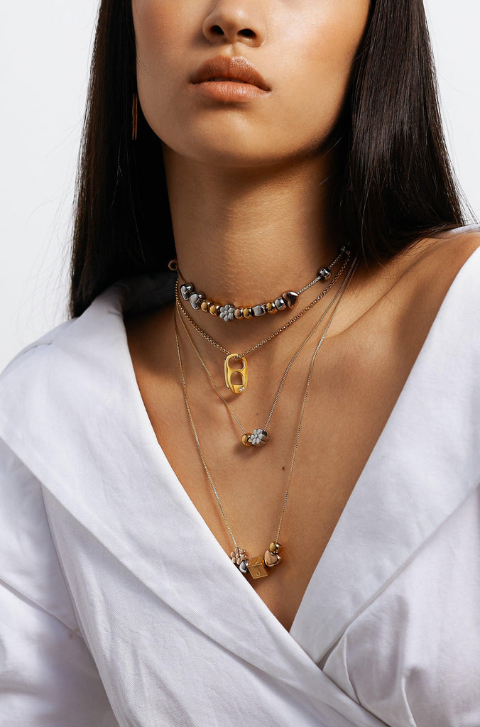 Full view of model wearing 4 Build it necklaces  Bagatiba
